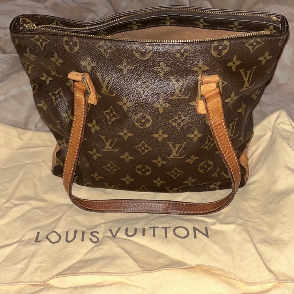 Authentic Louis Vuitton with dust bag.